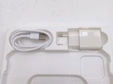 a white tray with a charger and a charger on it