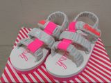 a box with a pair of baby shoes on it