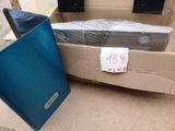 a cardboard box that has a laptop in it and a box with a sign on it