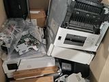 a cardboard box full of electronic equipment in a room
