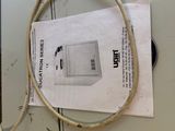 a box with a hose attached to it and a paper attached to it