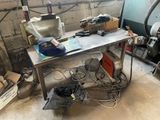 a work table with a bunch of tools on top of it