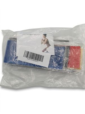 a plastic bag filled with assorted items on a white surface