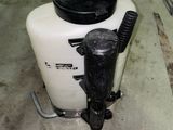 a white tank with a black lid and a black handle