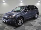 a picture of a blue suv parked in a garage