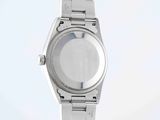 a close up of a wrist watch on a white surface
