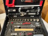 a tool case with tools in it sitting on a table