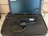 a laptop computer sitting on top of a black case