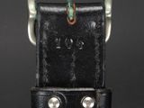 a close up of a leather belt with a metal buckle