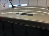 a close up of a car ' s roof with a remote control