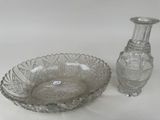 a glass bowl and a glass vase sitting on a table