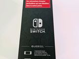 the nintendo switch box is open on a white surface