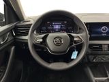 the interior of a car with a steering wheel, dashboard, and display screen