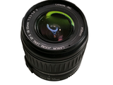 a camera lens that is sitting on a white surface