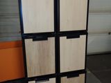 a refrigerator that has a lot of drawers in it