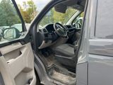 the interior of a car with the door open and the driver ' s seat down
