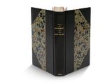 un livre noir et doré orné d'un motif doré
