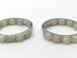 pair of white oplite hoop earrings with silver accents