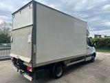 a picture of a white box truck parked in a parking lot