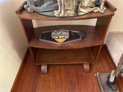 a small table with a dog statue on top of it