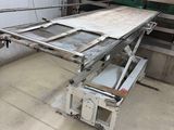 an image of a kitchen with a table in the middle of it