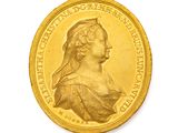l'image d'une pièce d'or sur laquelle figure le visage d'une femme
