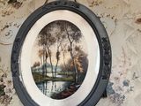 une photo d'un tableau accroché au mur
