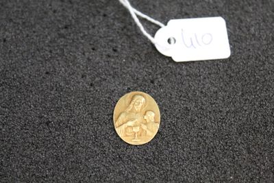 a gold coin with a picture of a woman on it