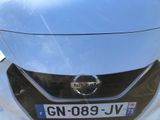 a close up of the front of a car with a license plate