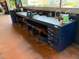 an image of a workbench in a garage with a lot of tools