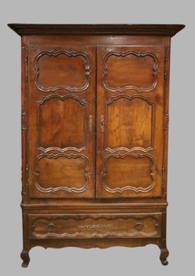 an old wooden armoire with carvings on the doors and drawers
