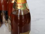 a close up of a bottle of wine on a table