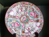 a decorative plate on a stand in a room