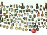 many different types of badges on a white surface