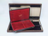 an open suitcase with a red lining on the inside of it