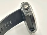 a close up of a watch on a white surface