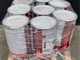 several cans of soda are wrapped in plastic on a pallet
