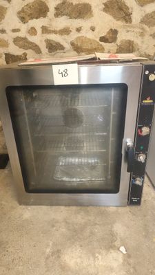 an image of a toaster oven sitting on the floor