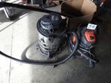 a picture of a vacuum and other tools in a garage