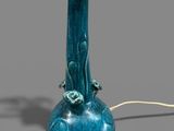 a blue lamp that is on a table next to a cord