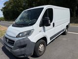 a picture of a white van parked on the side of the road