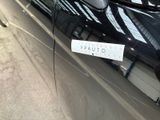 a picture of a car with a sticker on the door