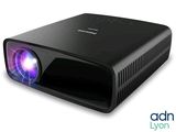 an image of a black projector with a purple light on it