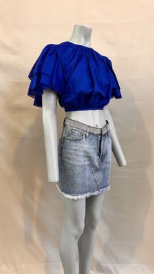 a mannequin wearing a blue top and denim skirt on a mannequin mannequin mannequin mannequin mannequin mannequin