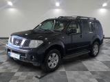 a picture of a black nissan suv parked in a garage