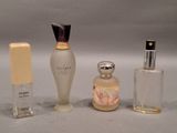 three different types of perfume bottles sitting on a table