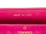 a close up of the inside of a pink purse