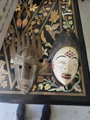 a table with two masks on top of it