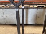 two pieces of metal sitting on top of each other