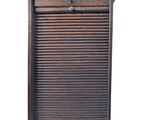 an old wooden shutter door with a drawer underneath it